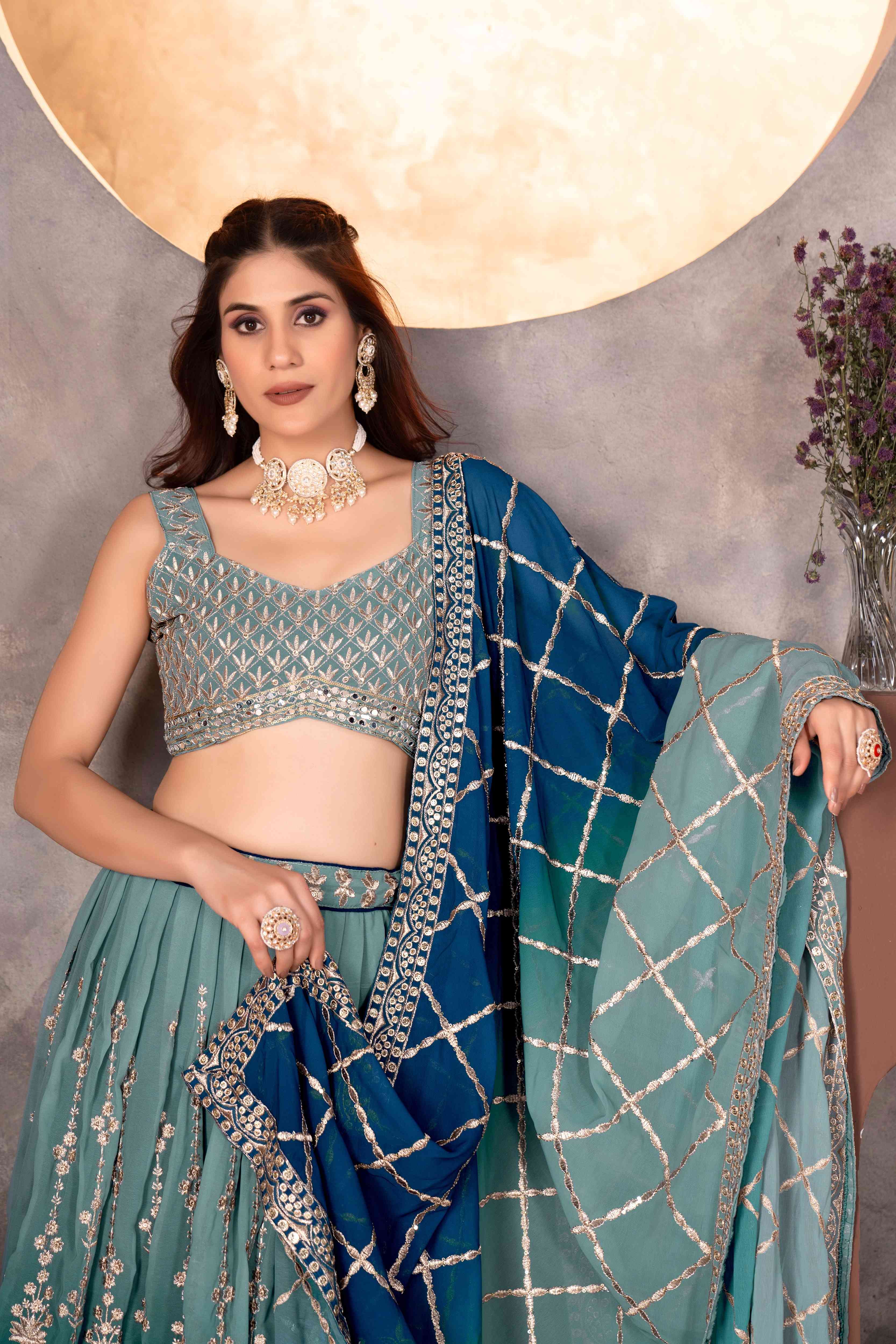 Attractive Teal Blue Embroidered Reception Wear Lehenga Choli With Dupatta