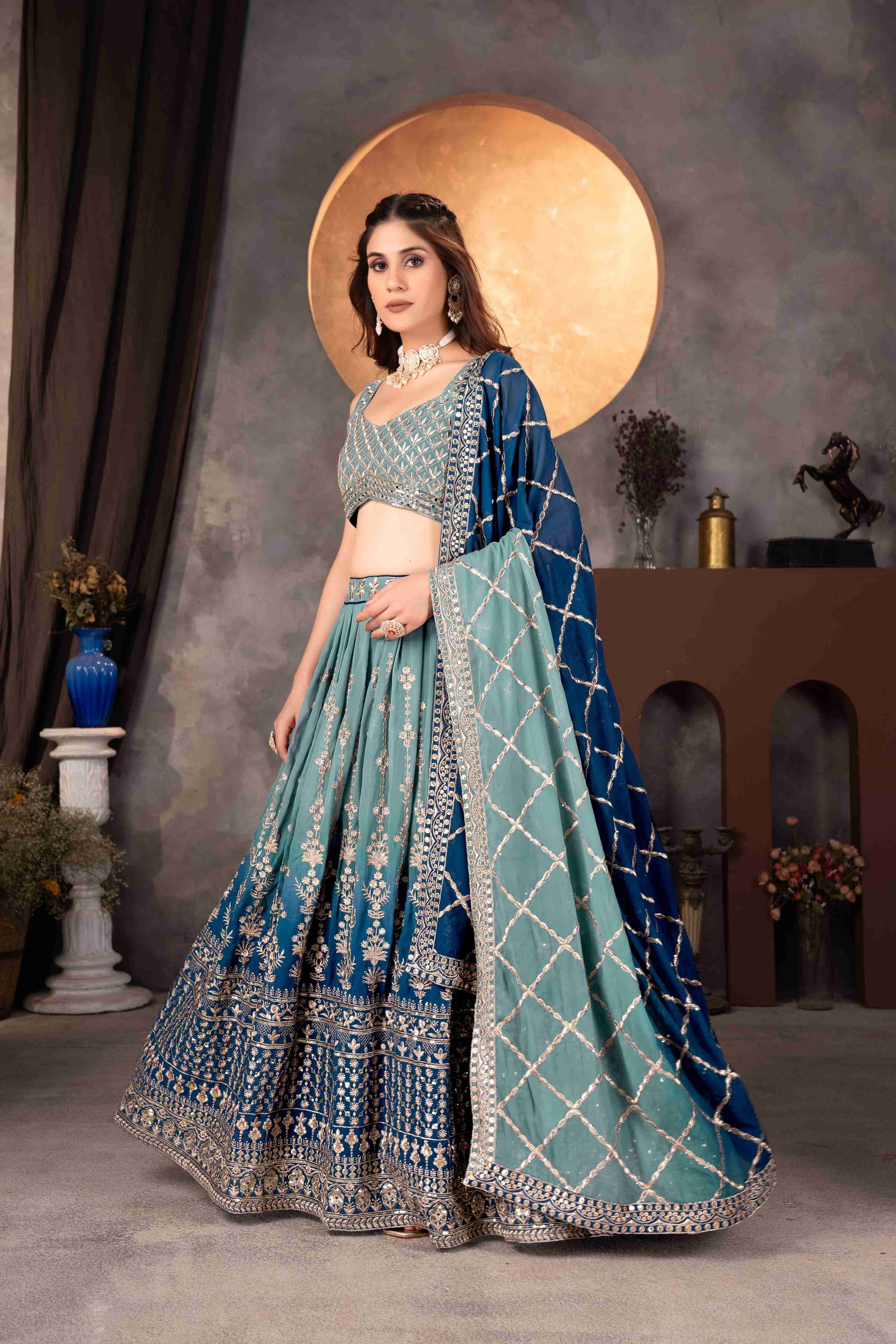 Attractive Teal Blue Embroidered Reception Wear Lehenga Choli With Dupatta