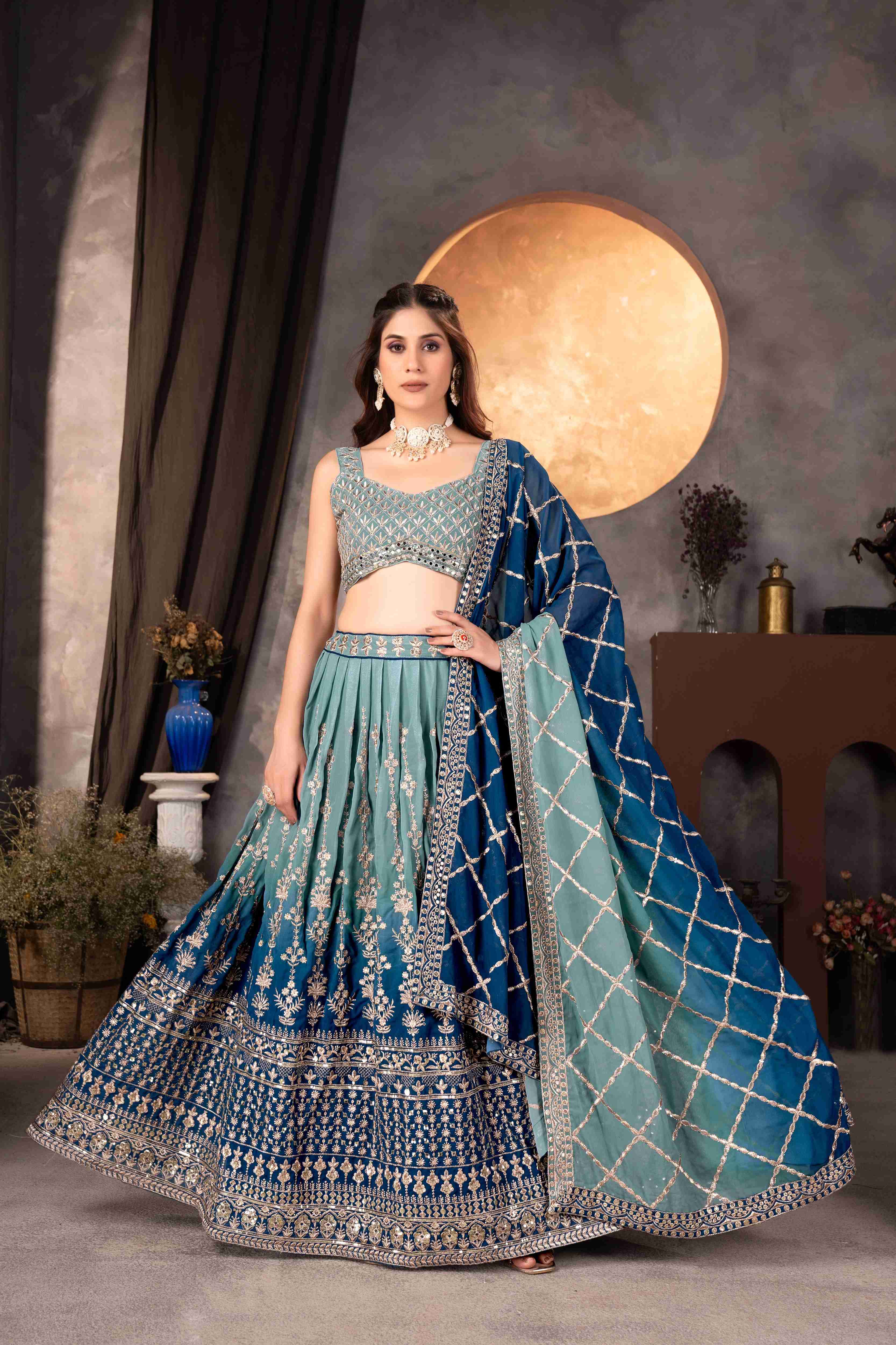 Attractive Teal Blue Embroidered Reception Wear Lehenga Choli With Dupatta
