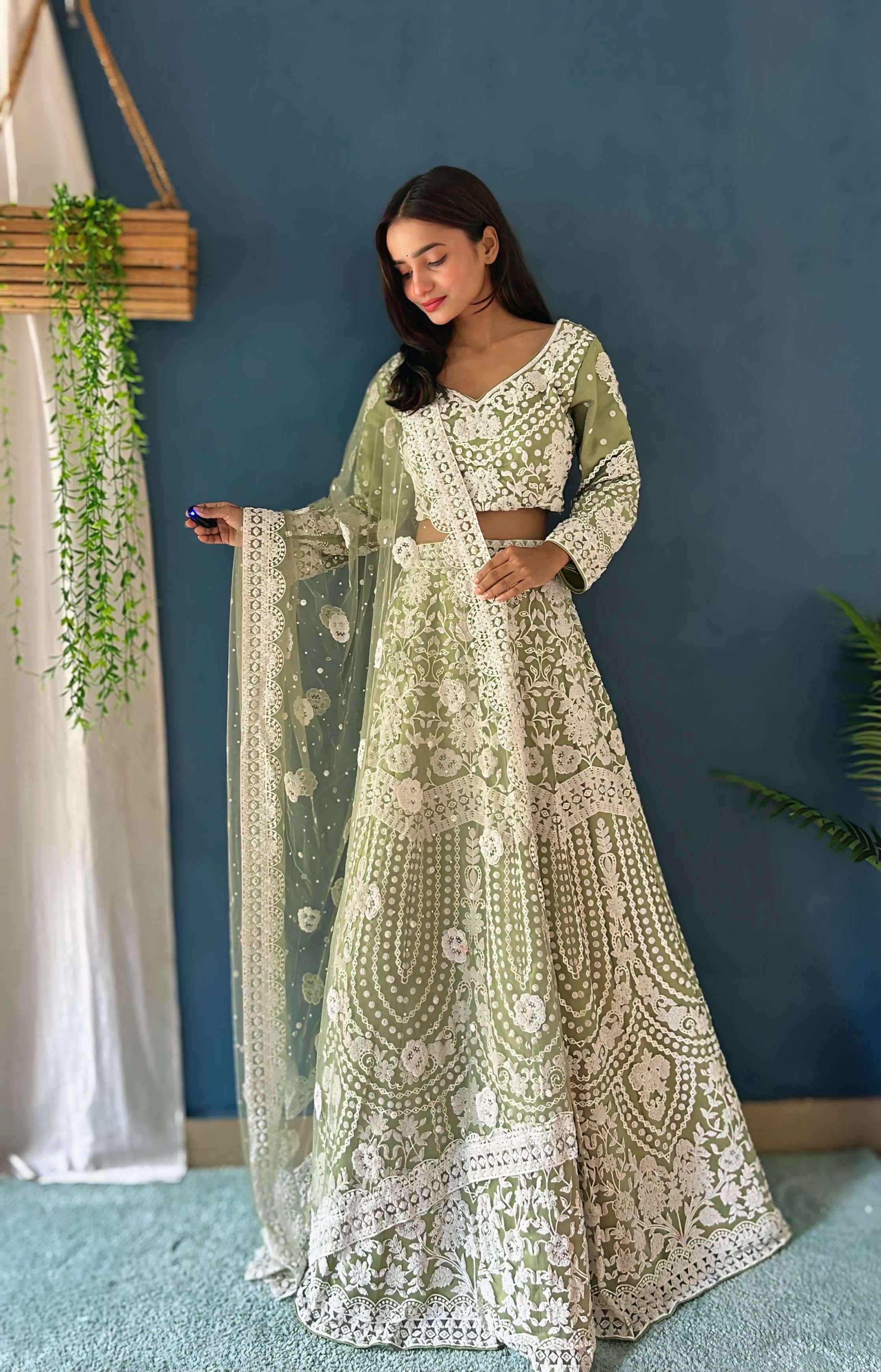 Wonderful Pastel Green Pure Bitts Pearl Designer Net Heavy Bridal Lehenga Choli with Amazing Dupatta