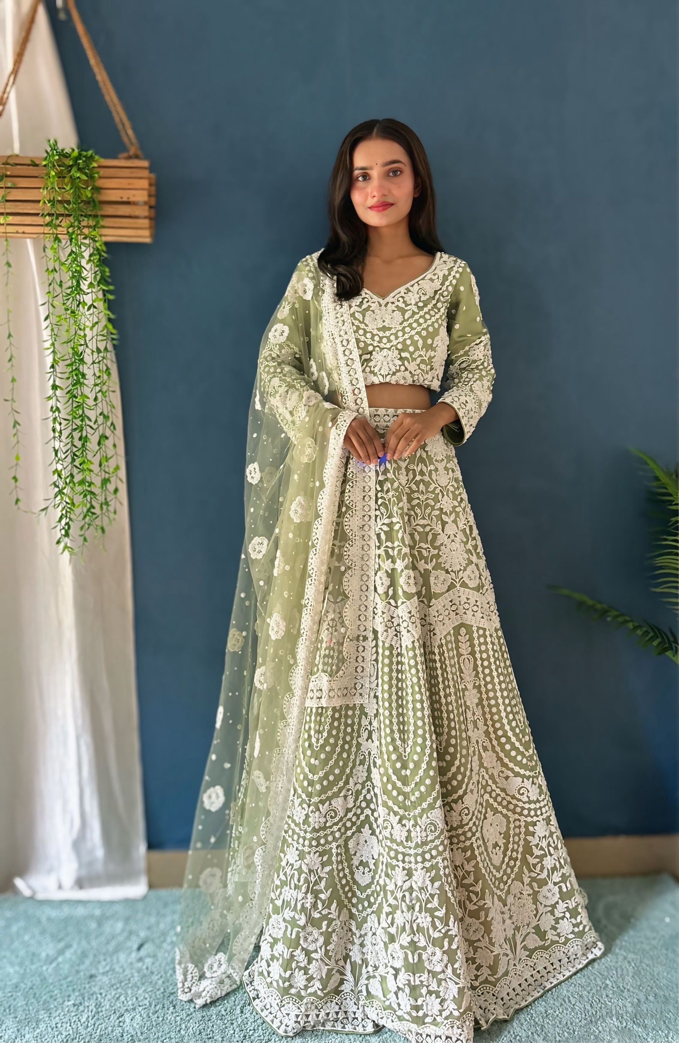 Wonderful Pastel Green Pure Bitts Pearl Designer Net Heavy Bridal Lehenga Choli with Amazing Dupatta